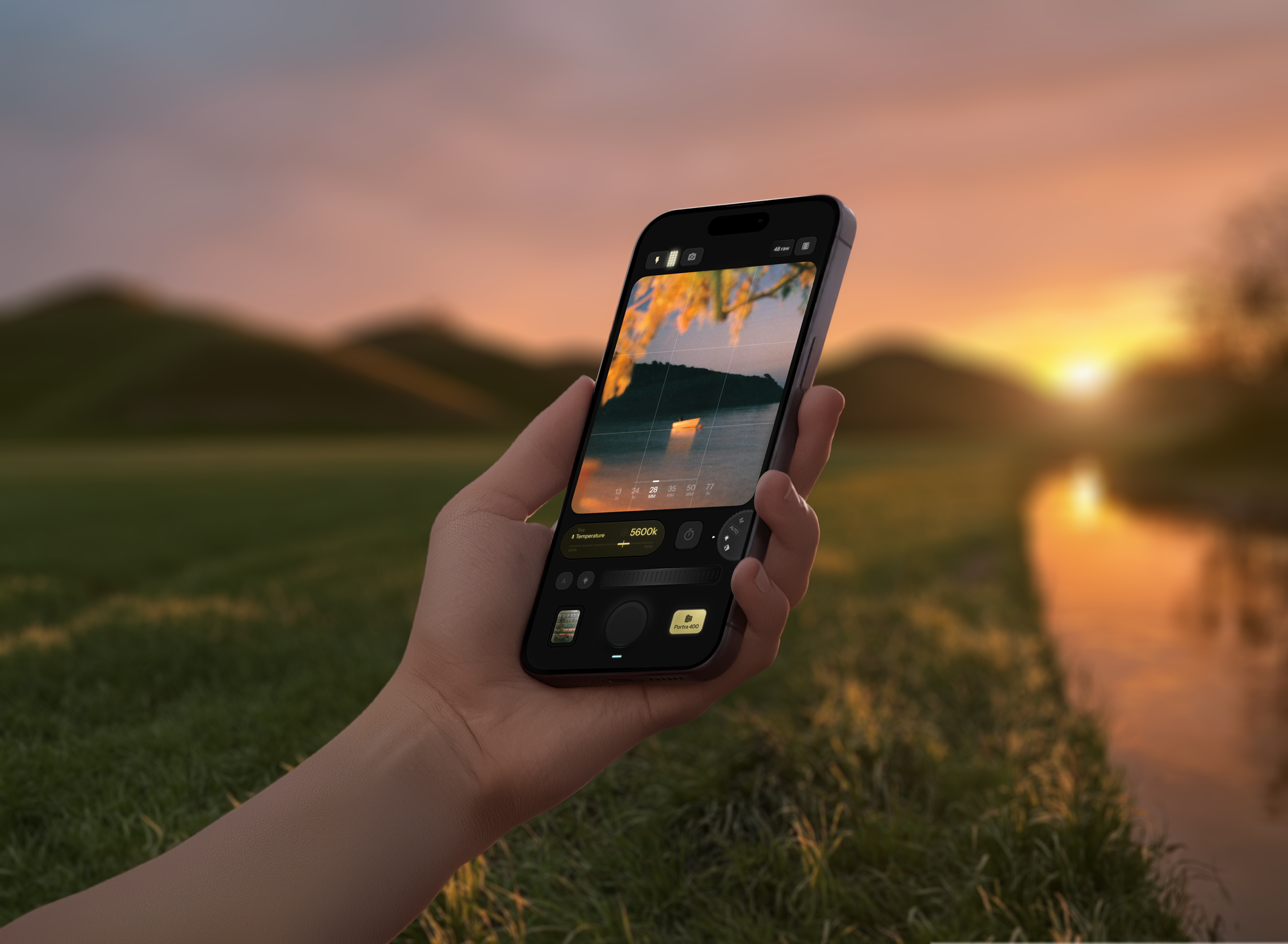 Fodo tactile camera interface held against a sunset landscape